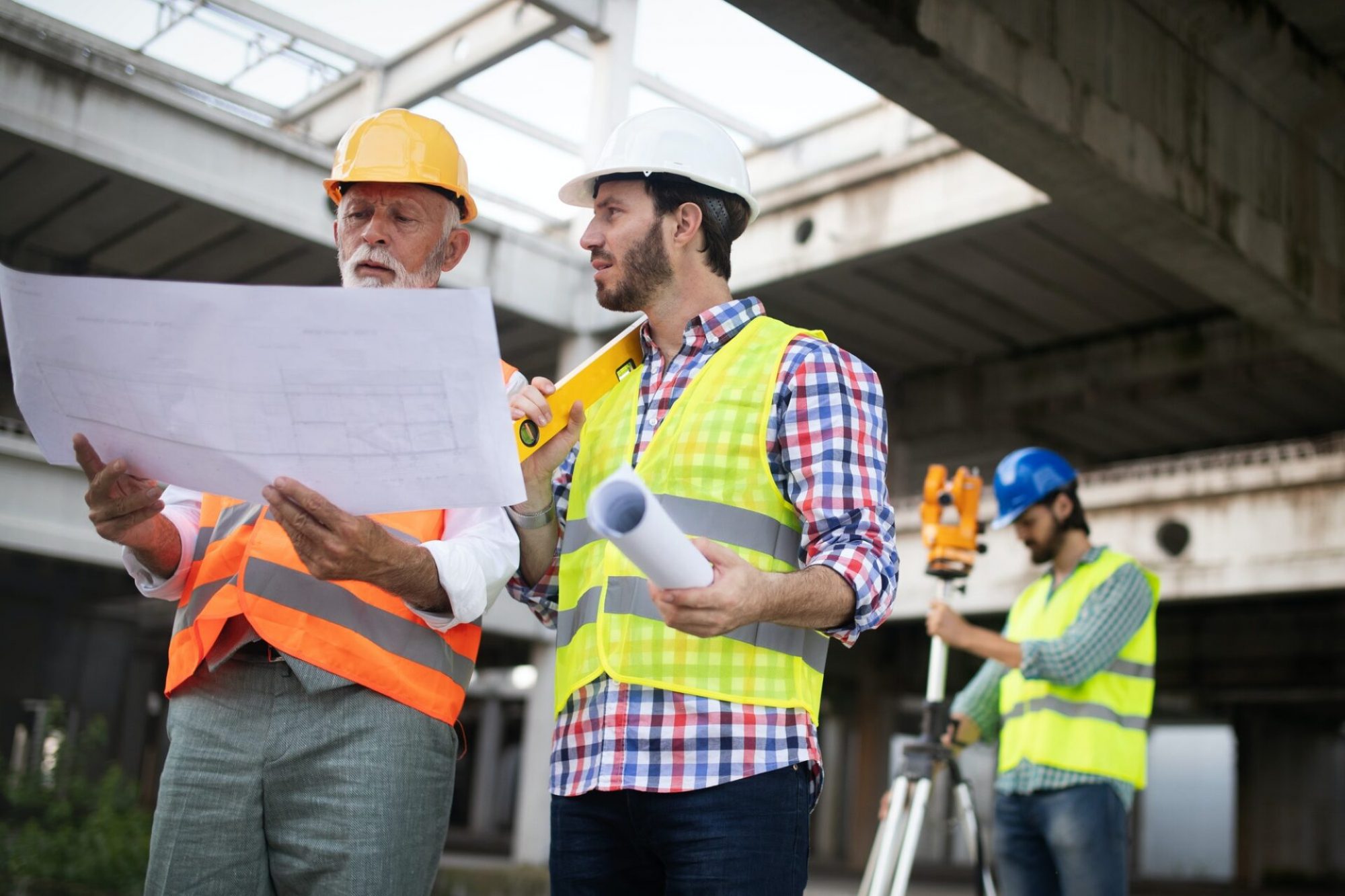 engineer-foreman-and-worker-discussing-in-building-construction-site.jpg